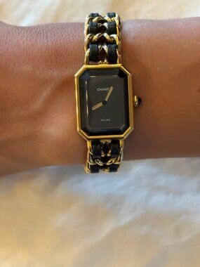 Elegant vintage CHANEL Premiere women's watch in the classic black-and-gold Chan